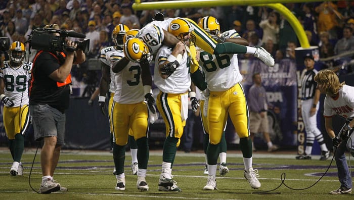 Brett Favre lifted Greg Jennings onto his shoulders after breaking Dan Marino's touchdown record in 2007. (John Biever/Sports Illustrated)